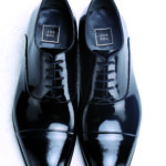 JOE SHU_Black patent cap toe shoes_Rs 10,990