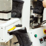 Worker,Adjusts,Machine,For,Production,Of,Footwear